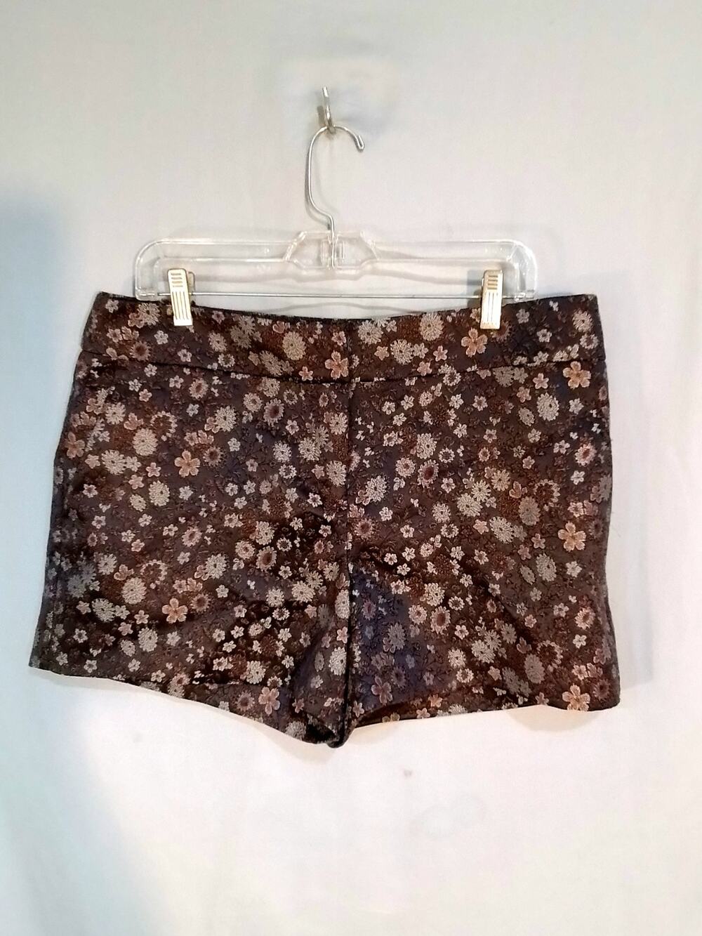 Gray tapestry shorts. Silver and rusty flowers on black background